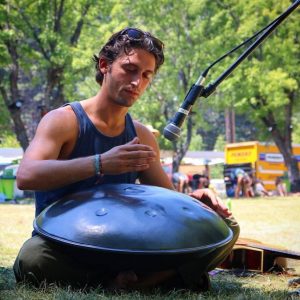 Darin Lehman, Yoga Teacher Training Facilitator playing a Pantam steel hand pan