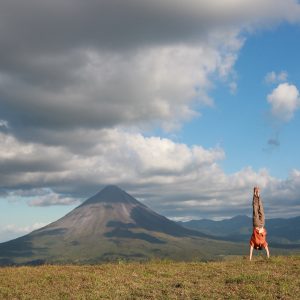 Darin Lehman, Yoga Teacher Training Facilitator doing handstand in Peru