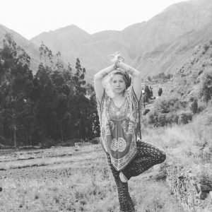 Srimati, Yoga Teacher Training Facilitator in tree pose, or vriksasana