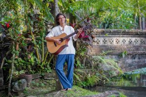 Darin Lehman standing with guitar