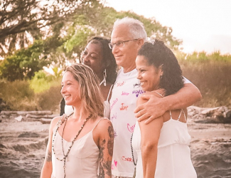 Costa Rica students hug sunset
